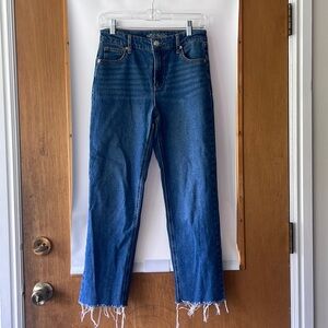 Blue jeans with frayed bottom